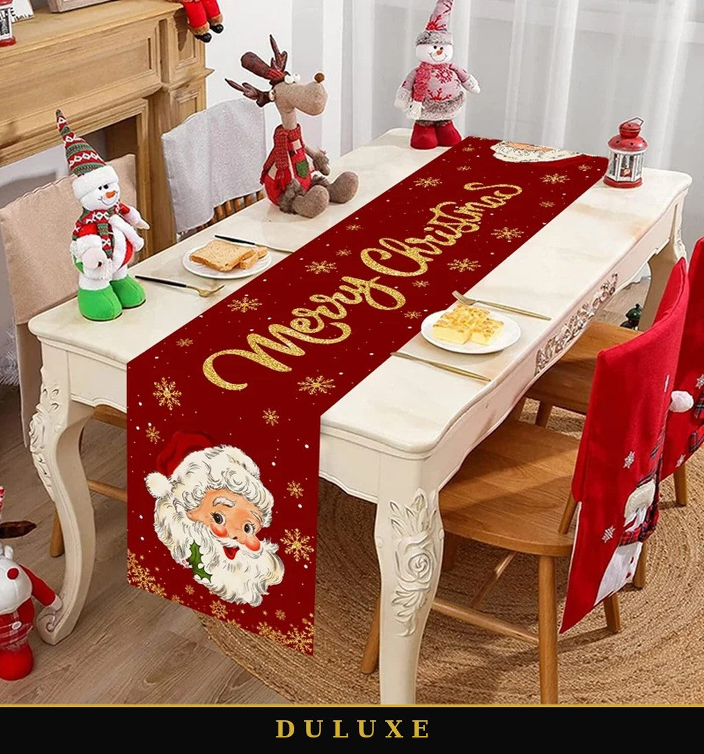Chemin de table de Noël rouge DULUXE au Père Noël et inscription dorée, dressé sur une table de fête