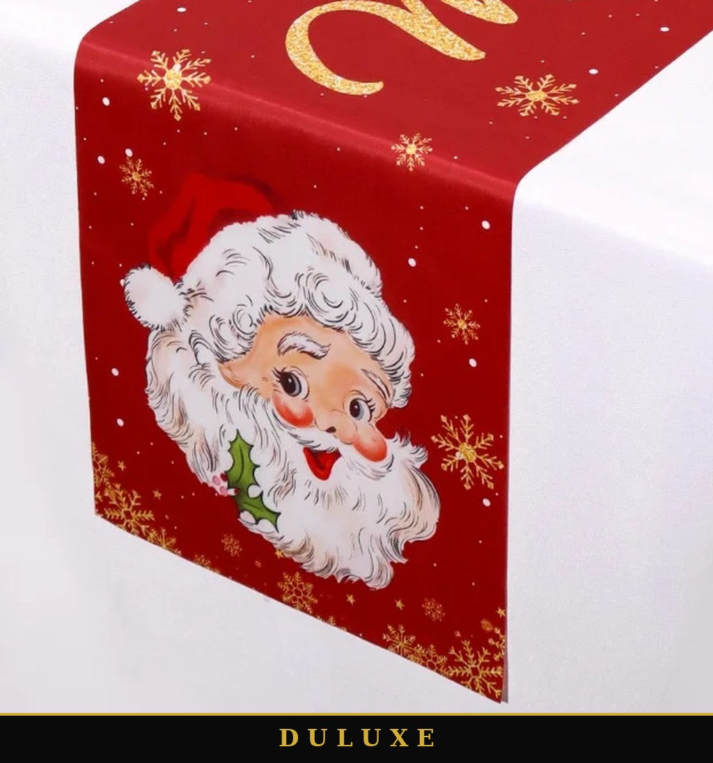 Gros plan sur le visage souriant du Père Noël du chemin de table de Noël DULUXE