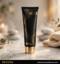 Tube de crème réparatrice pieds et talons DULUXE noir et doré sur marbre blanc, présentation premium
