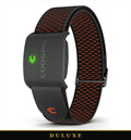 Brassard cardiaque connecté noir et orange DULUXE, capteur de fréquence cardiaque avec LED verte allumée