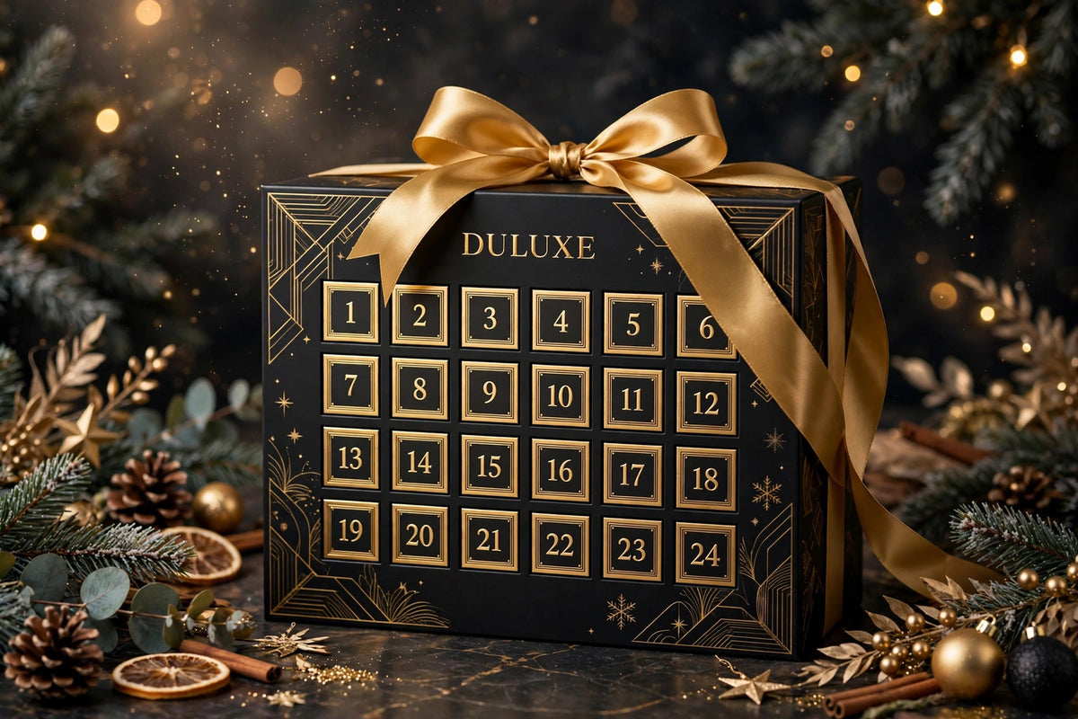 Présentation cadeau du Calendrier de l'Avent avec un ruban doré satiné