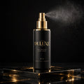 Spray Volumisant Capillaire DULUXE – flacon noir et doré sur fond noir et or
