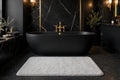 Tapis de Bain Absorbant Antidérapant DULUXE – tapis gris dans une salle de bain luxueuse noir et doré