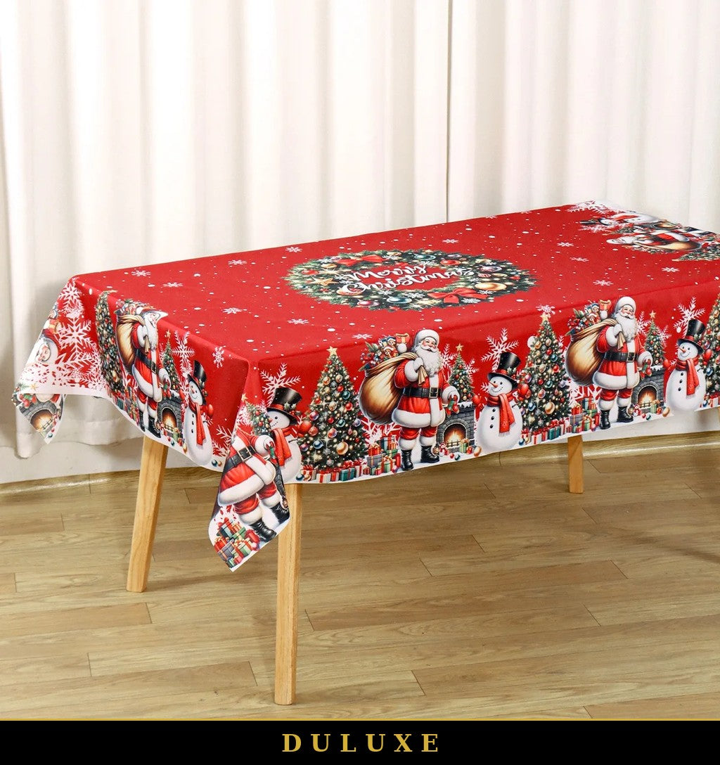 Nappe de Noël rectangulaire rouge DULUXE à motifs Père Noël, table du réveillon près du sapin
